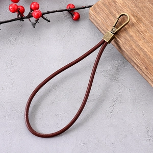 Vintage dark brown leather wrist lanyard with antique bronze metal spring buckle for phones