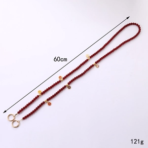 Long red beaded phone chain with 60cm length and floral enamel charms for crossbody use