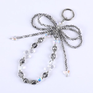 Elegante ciondolo a fiocco con perle di cristallo grigio e farfalla iridescente