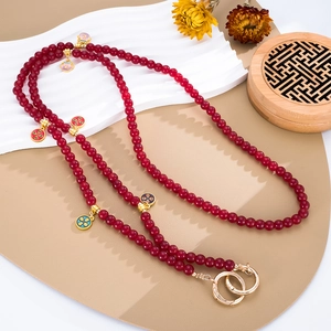 Ethnic style long beaded phone crossbody chain with wine red beads and floral charms