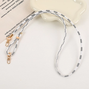 Checkerboard pattern woven phone strap with golden metal lobster clasps and buckles