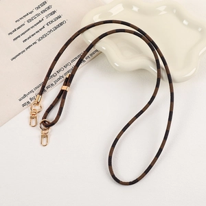 Detail of adjustable checkered leather lanyard with golden lobster clasps and metal rings