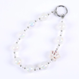 Iridescent white resin star phone charm with purple butterfly glitter and silver metal ring