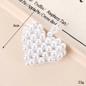 Handmade woven pearl heart keychain pendant in warm cream tone for bags and keys