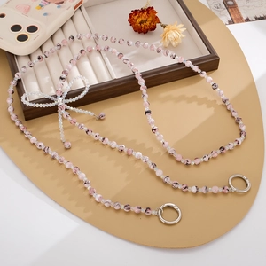 Elegante cordón para móvil de cuentas marmoleadas con colgante de lazo transparente