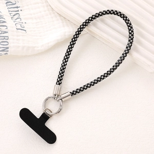 Close-up of luxury black rhinestone wrist strap with silver ring clasp and phone tether tab