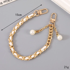 Minimalist light gold bag chain with woven white leather and elegant pearl charms