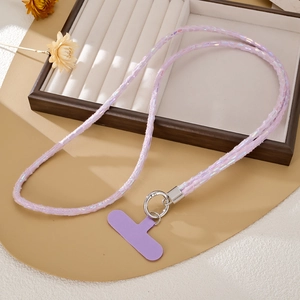 Close-up of a purple iridescent plush phone strap with silver ring and matching connector