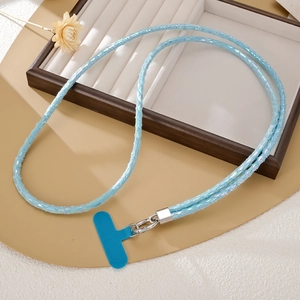 Light blue woven phone strap with glitter accents and silver metal hook on a white tray