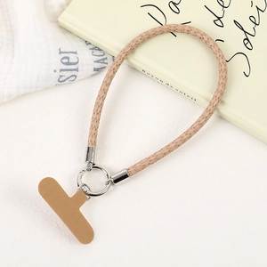 Close-up of a light brown PU leather braided phone wrist strap with metal ring and T-shaped pad