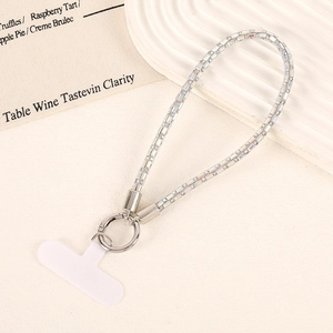 Detailed view of luxury rhinestone wrist strap with silver ring buckle and white T-patch