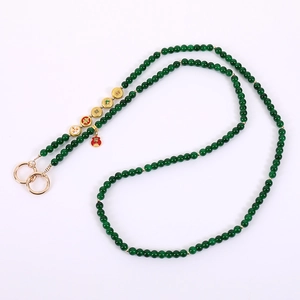 Chinese style crossbody phone lanyard with green beads, gold rings and red fortune bag