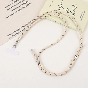 Detail of adjustable beige hand-woven crossbody phone lanyard with silver metal hardware