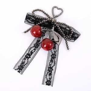 Creative cherry charm with black lace bow and red glitter cherries on a metal chain