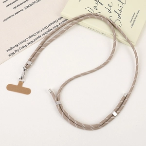 Close-up of adjustable woven phone strap with silver swivel hook and brown cord