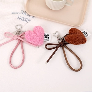Plush heart bag charm with elegant bow and silver metal clasp in pink and brown