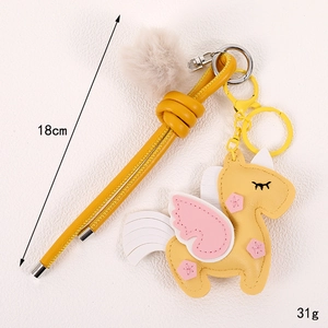 Yellow PU leather unicorn charm with pink wings and beige pompom for bags, 18cm length