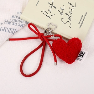 Minimalist red plush heart bag charm with a soft bow and silver heart-shaped metal clasp