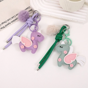 Handmade PU leather unicorn charms with fluffy pom poms and braided straps for bags