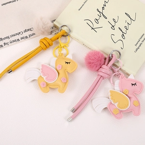 Cute PU leather unicorn bag charms with plush pompom and metal keychains, pink and yellow set