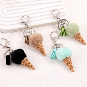 Faux fur pompom ice cream keychain with tassel and metal clasp in four pastel colors