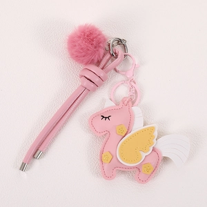 Pink PU leather unicorn bag charm with plush ball and braided keychain strap