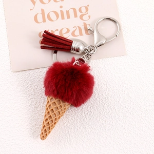 Detail of red faux fur ice cream keychain with resin cone, tassel and silver clasp