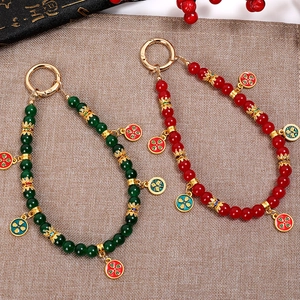 Chinese style beaded phone wrist strap with jade-like beads and enamel floral pendant