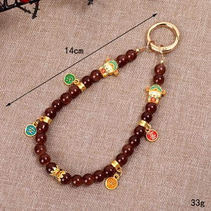 Handmade red beaded phone strap with God of Wealth charms and Chinese lucky tags