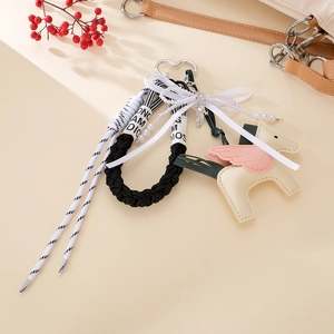 Handcrafted leather Pegasus bag charm with braided rope and pearls for fashion handbags