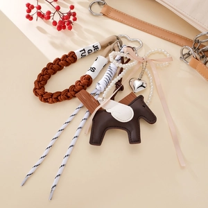 Cute brown faux leather pegasus bag charm with pearl beads and braided rope keychain