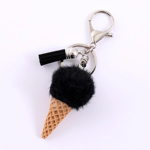 Chic resin ice cream keychain featuring a fluffy black fur ball and yellow cone charm
