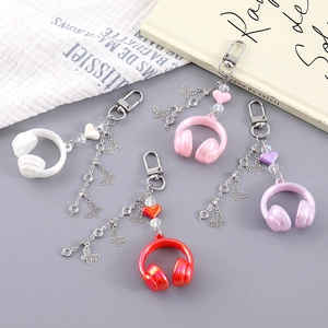 Detailed view of creative headphone keychains with butterfly and heart charms in four colors