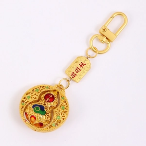 Exquisite gold hollow globe keychain with lucky gourd pendant and safety talisman tag