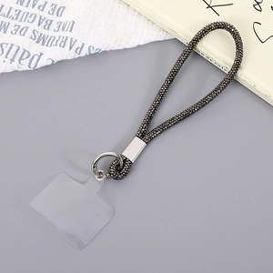 Macro detail of luxury rhinestone chain wrist strap with silver ring for mobile phone