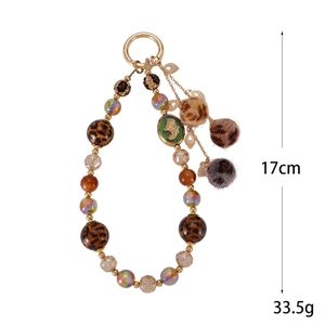 Leopard print plush ball phone charm with handmade beads and gold leaf pendant