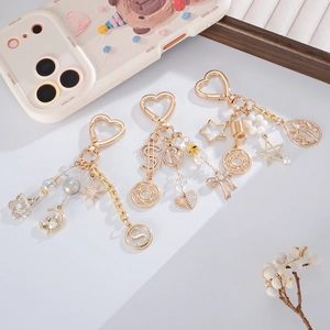 Golden cat keychain with rhinestone stars and butterfly pendants for bags and phone cases