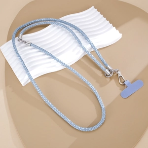 Detail of light blue rhinestone phone lanyard with silver metal clasps and matching pad