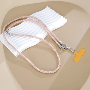 Detailed view of a pink rhinestone phone strap with silver metal buckles and yellow pad