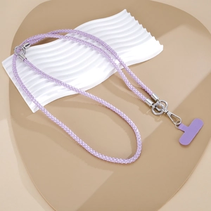 Detail shot of purple rhinestone phone strap with silver clasp and card on display