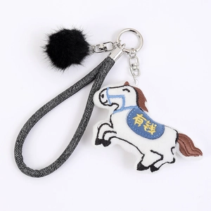 Cartoon stuffed horse keychain with gold embroidery Lucky Money and black pom pom charm
