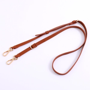 Adjustable brown lychee pattern leather shoulder strap with gold swivel hooks and D-ring