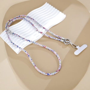 Close-up of colorful beaded phone strap with silver lobster clasp and heart padding