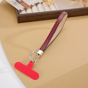 Cinturino per telefono in pelle con T-pad rosso e cinturino da polso con motivo mattoni