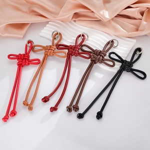 Handmade PU leather woven Ruyi knot charms in five festive colors with silver metal rings