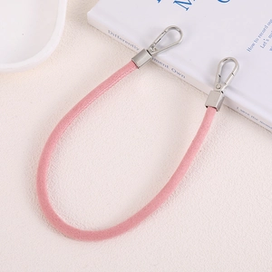 Pink suede-textured wrist strap with silver metal spring carabiners for bags