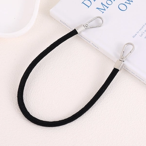 Detail of black suede rope strap with dual silver metal lobster clasps for bags or phones