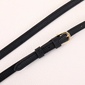 Adjustable black lychee leather bag strap with dual gold buckles for crossbody use
