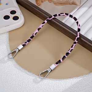 Detailed view of pink leopard print PU leather strap with silver lobster claw metal clasps