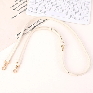 Adjustable cream leather bag strap featuring gold swivel clasps and functional holes
